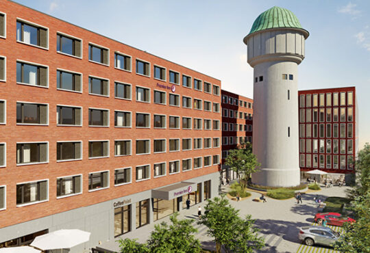 In Karlsruhe starten Projektentwickler TIMONGRUPPE und Betreiber Premier Inn mit dem Richtfest die letzte Bauphase für ein 199-Zimmer Hotel direkt am Hauptbahnhof